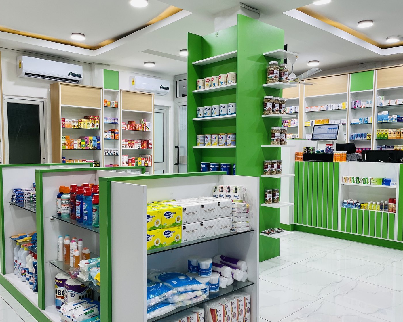 The Unihealth Pharmacy shop floor in Accra, with the dispensary counter in the background.